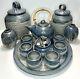 13 Pc. Pottery Set 6 Cups, 1 Tray, 2 Canisters, 1 Sugar Bowl, 1 Teapot, 2 Vases