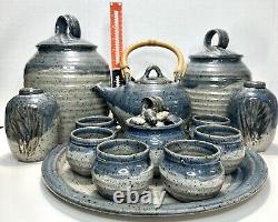 13 Pc. Pottery Set 6 Cups, 1 Tray, 2 Canisters, 1 Sugar Bowl, 1 Teapot, 2 Vases