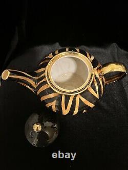 African? Mini tea cup, saucer set of 6, Included Tea Pot. Made from Africa