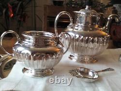 An ANTIQUE SILVER PLATED SELF POURING TEAPOT SET AND TRAY JAMES DIXON