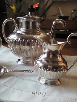 An ANTIQUE SILVER PLATED SELF POURING TEAPOT SET AND TRAY JAMES DIXON