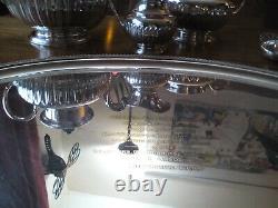 An ANTIQUE SILVER PLATED SELF POURING TEAPOT SET AND TRAY JAMES DIXON