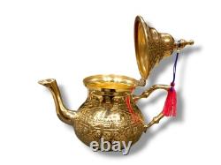 Elegant Moroccan tea set six cups, a teapot, and a handmade golden tray