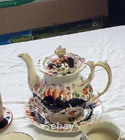 Gaudy Welsh tea set. Tea pot, 1 tea cup, 3 plates, a creamer and sugar dish