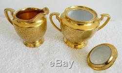 Pickard gold tea set with teapot, creamer, sugar, and underplate marked
