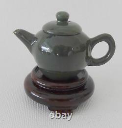 Set of eight vintage carved semi-precious stone miniature tea pots