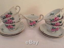 Tea Cups and saucers with matching creamer