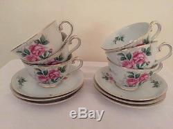 Tea Cups and saucers with matching creamer