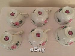 Tea Cups and saucers with matching creamer