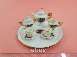 Vintage Miniature set Cups Saucers Teapot, Sugar Bowl and Creamer Women Pictured