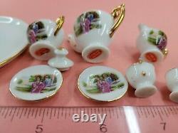 Vintage Miniature set Cups Saucers Teapot, Sugar Bowl and Creamer Women Pictured