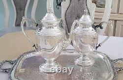 WM Rogers $ Son, Spring Flower Silver-plated Coffee/Teapot set Beautiful