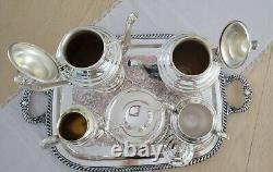 WM Rogers $ Son, Spring Flower Silver-plated Coffee/Teapot set Beautiful