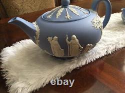Wedge wood blue jasperware teapot, sugar bowl with cover, and creamer